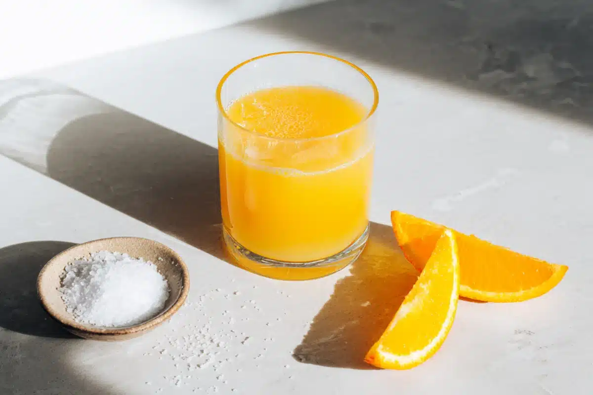 All Recipes Adrenal cocktail recipe in a glass with orange slices and sea salt